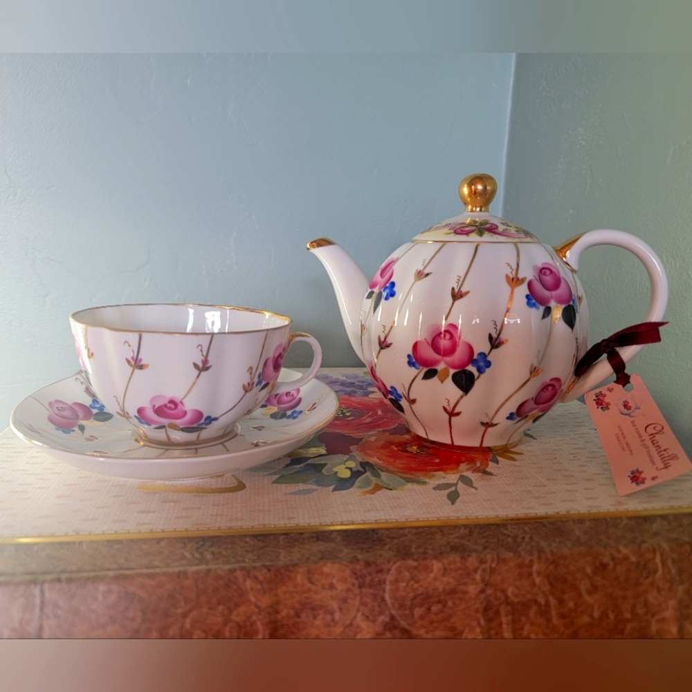 Vintage Teapot with matching cup and saucer from St Petersberg Russia.